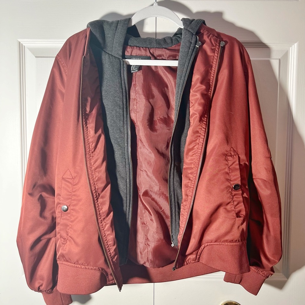 Used Forever 21 Bomber Jacket. Size medium. Maroon and gray colored jacket.